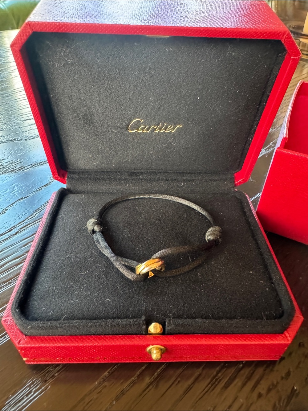 Cartier Trinity Bracelet with 18k rose, yellow, and white gold.